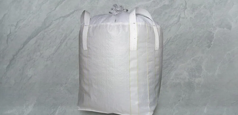 FIBC bag with a large top opening closed by a tie cord and four loops